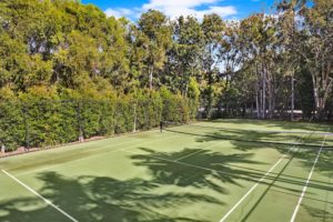 Full size tennis court waiting for you at Coral Beach Noosa Resort